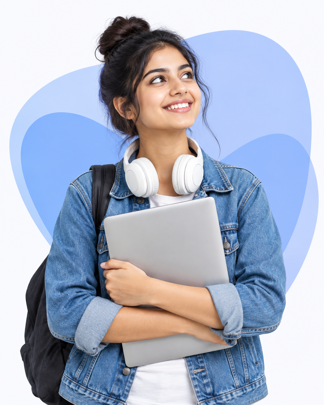 Smiling learner holding a laptop